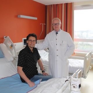 PD Dr. Laß mit Patient